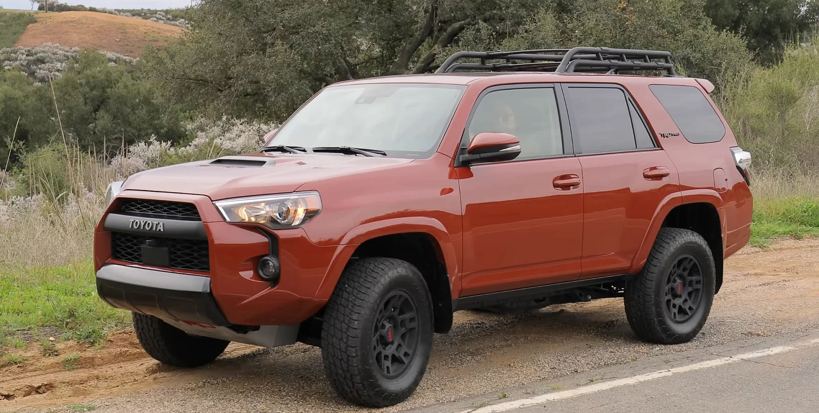 Orange Toyota 4 Runner SUV Front Profile 