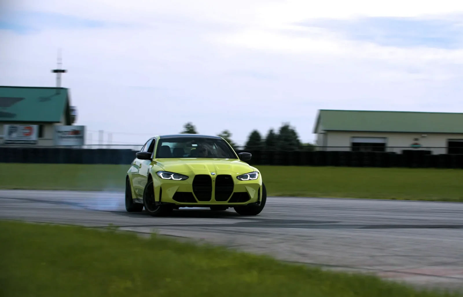 Yellow 2024 BMW M3 Competition Drifting