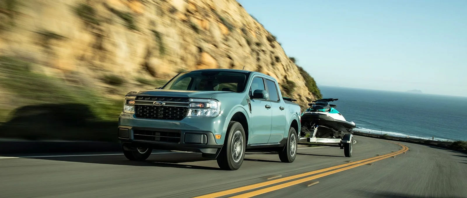 Grey 2024 Ford Maverick Pickup Truck Towing A Boat