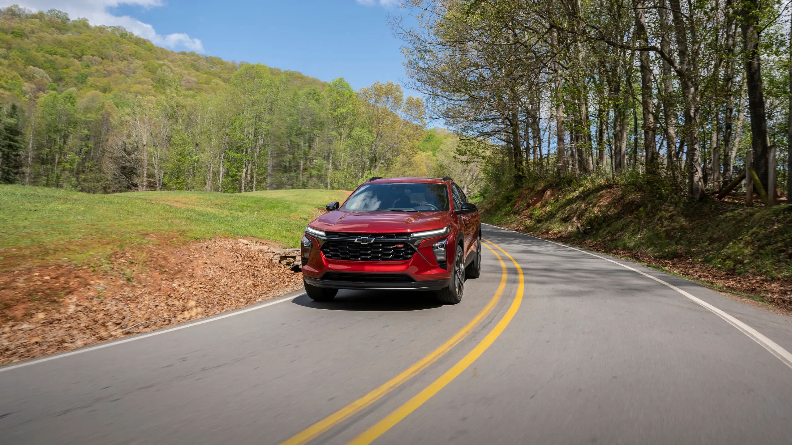 2024 Chevy Trax driving down a road