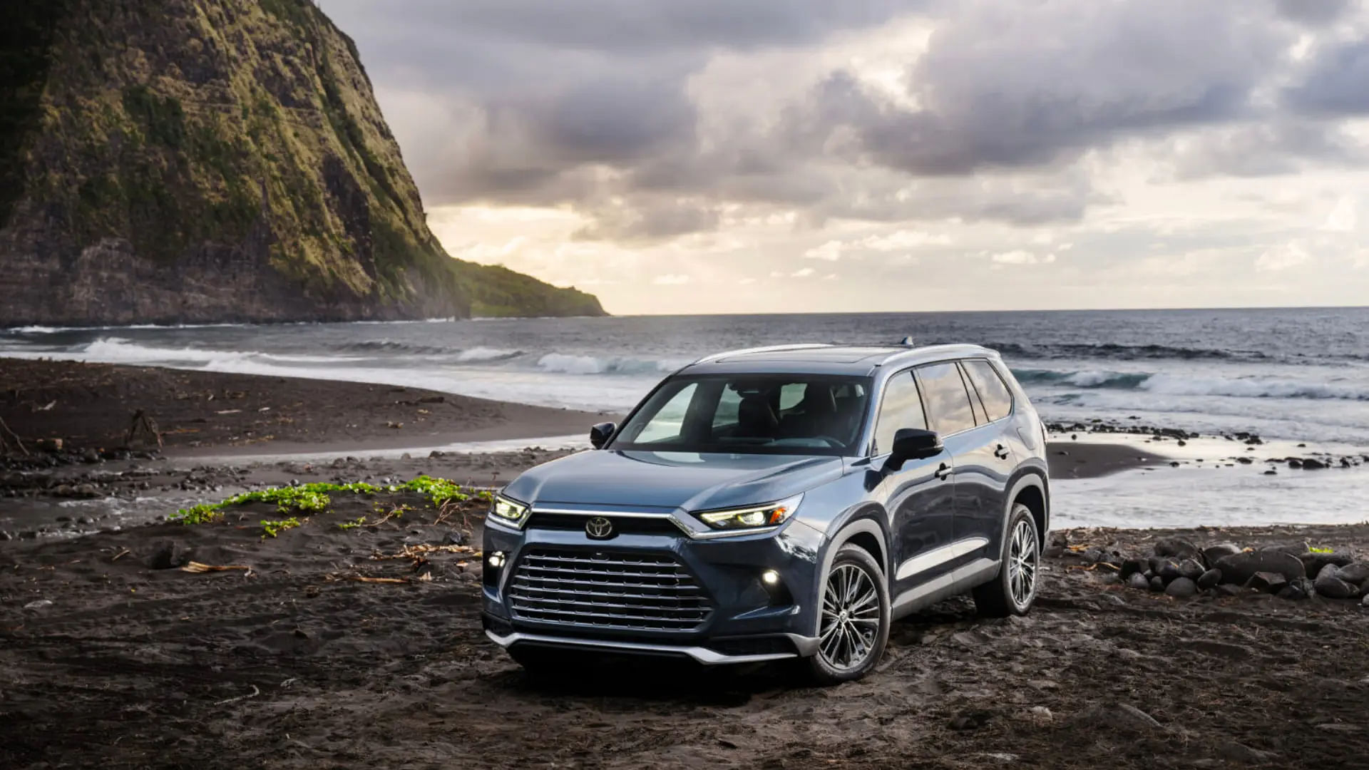 2024 Grand Highlander standing on a beach