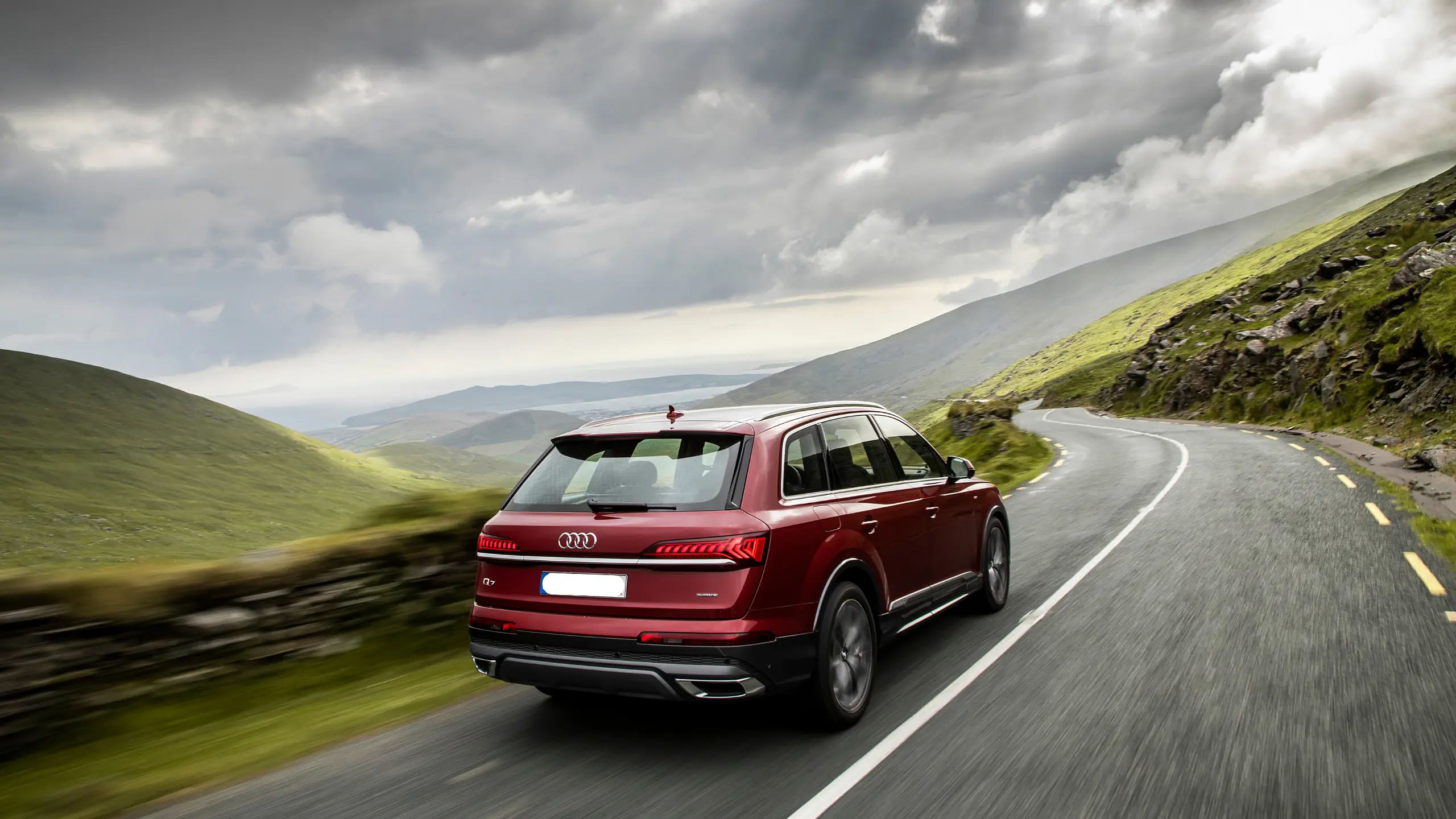 rear view of Red Audi Q7 driving