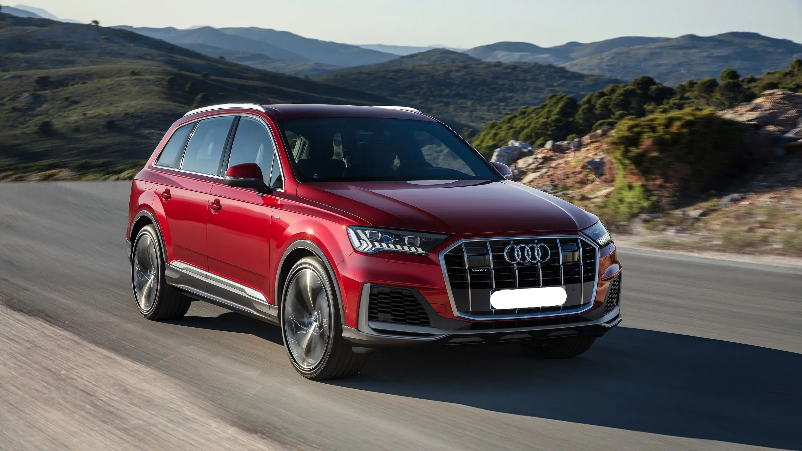 Red Audi Q7 driving